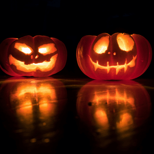 Halloween pumpkins with a candle lit within